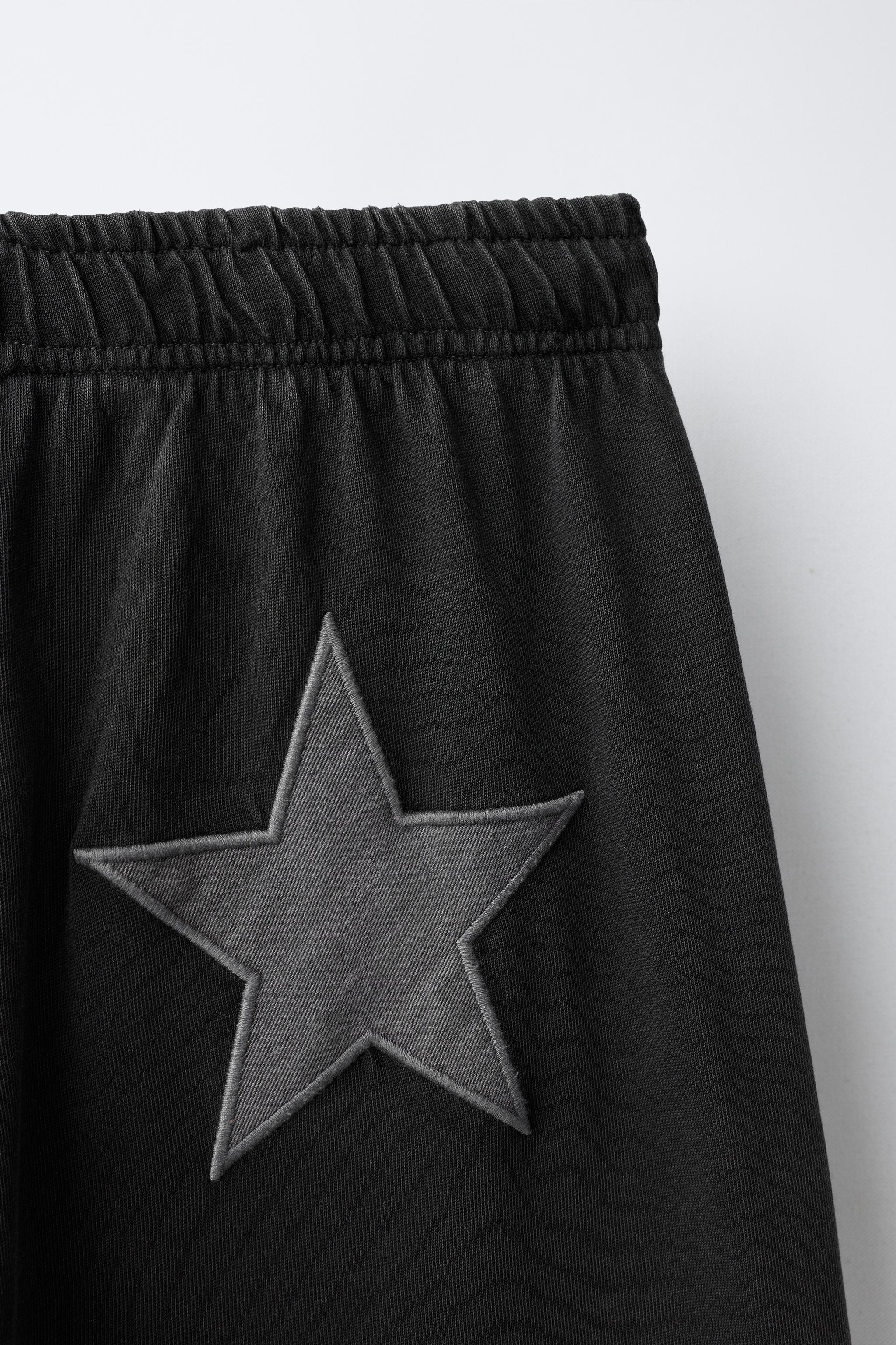 WASHED EFFECT STAR WIDE-LEG PANTS